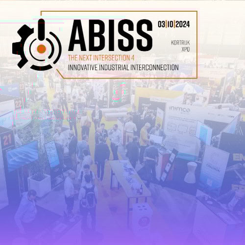 Crowded exhibition hall at the ABISS 2025 event in Kortrijk Xpo, showcasing various industrial technology booths and attendees networking.